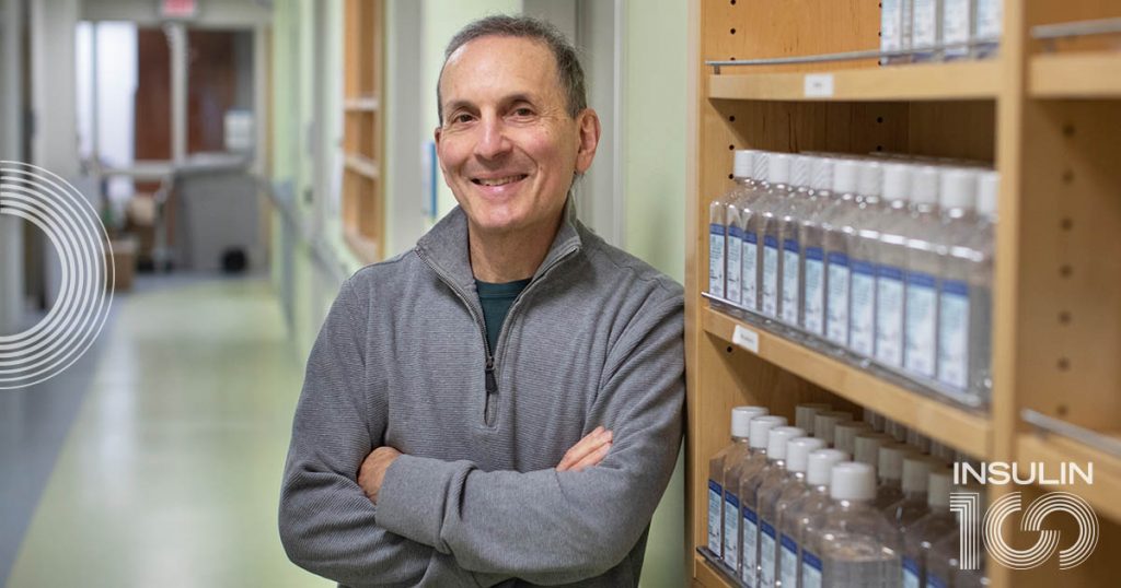 Daniel Drucker stands in a research building